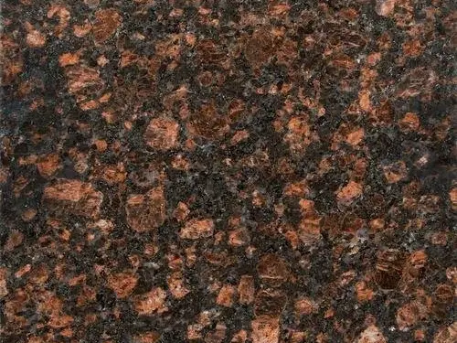 Tan Brown Granite Slab Specifications Primary Color(s): Brown, Black Accent Color(s): Tan, Gray Material Type: Granite Price Range: Medium Finish: Polished (Other finishes available upon request) Slab Thickness: 2 cm, 3 cm, 4 cm, 5 cm, 6 cm, 8 cm, 10 cm, 12 cm Country of Origin: India Tan Brown Granite