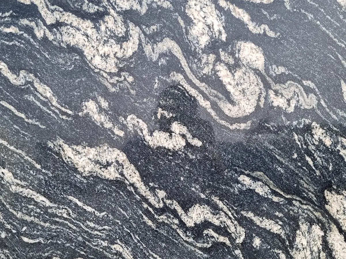 Black Forest Granite Slab Specifications Primary Color(s): Black, Dark Brown Accent Color(s): Gray, White, Gold Material Type: Granite Price Range: Medium Finish: Polished (Other finishes available upon request) Slab Thickness: 2 cm, 3 cm, 4 cm, 5 cm, 6 cm, 8 cm, 10 cm, 12 cm Country of Origin: India Black Forest Granite