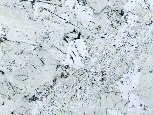 Avalanche Granite Slab Specifications Primary Color(s): White, Gray Accent Color(s): Black, Beige, Brown Material Type: Granite Price Range: Medium Finish: Polished (Other finishes may be available upon request) Slab Thickness: 2 cm, 3 cm, 4 cm, 5 cm, 6 cm, 8 cm Country of Origin: India Avalanche Granite Slab